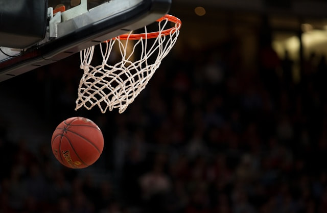 A Ball Going Through a Basketball Ring